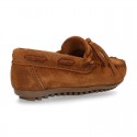 Indian style Moccasin shoes with bows in suede leather.