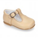 Classic Nappa leather T-strap shoes with buckle fastening.