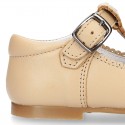 Classic Nappa leather T-strap shoes with buckle fastening.