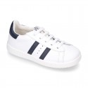 Washable leather school tennis shoes with shoelaces and stripes design.