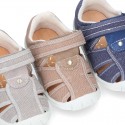 Combined sandal shoes with hook and loop strap, toe cap and counter.
