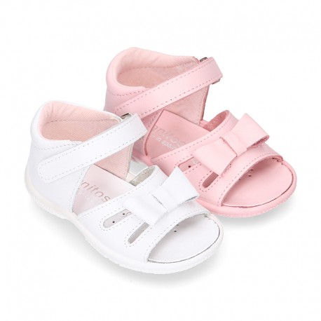 Washable leather sandals with big bow and hook and loop strap for little girls.