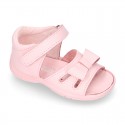 Washable leather sandals with big bow and hook and loop strap for little girls.