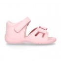 Washable leather sandals with big bow and hook and loop strap for little girls.