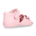 Washable leather sandals with big bow and hook and loop strap for little girls.