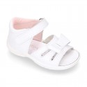 Washable leather sandals with big bow and hook and loop strap for little girls.