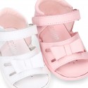 Washable leather sandals with big bow and hook and loop strap for little girls.