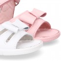 Washable leather sandals with big bow and hook and loop strap for little girls.
