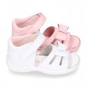 Washable leather sandals with big bow and hook and loop strap for little girls.