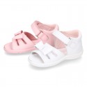 Washable leather sandals with big bow and hook and loop strap for little girls.