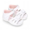 Washable leather sandals with big bow and hook and loop strap for little girls.