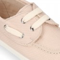 Cotton canvas boat shoes with ties closure.