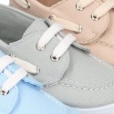 Cotton canvas boat shoes with ties closure.