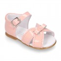 New patent leather sandals with ribbon for little girls.