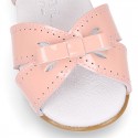 New patent leather sandals with ribbon for little girls.