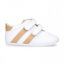 Tennis style shoes for babies laceless in leather.