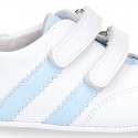 Tennis style shoes for babies laceless in leather.