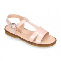 Patent Leather T-Strap Sandal shoes with crossed straps for girls.