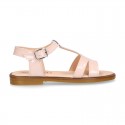 Patent Leather T-Strap Sandal shoes with crossed straps for girls.