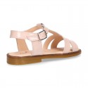 Patent Leather T-Strap Sandal shoes with crossed straps for girls.