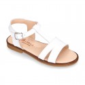 Patent Leather T-Strap Sandal shoes with crossed straps for girls.