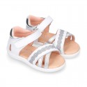 Little Washable leather Sandal shoes with crossed straps and hook and loop closure.