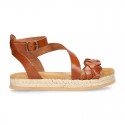 Cowhide leather sandal shoes espadrille style with braided design and buckle closure to the ankle.