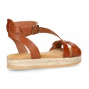 Cowhide leather sandal shoes espadrille style with braided design and buckle closure to the ankle.