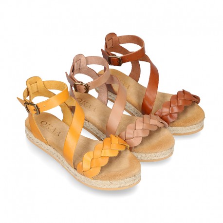 Cowhide leather sandal shoes espadrille style with braided design and buckle closure to the ankle.