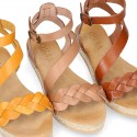 Cowhide leather sandal shoes espadrille style with braided design and buckle closure to the ankle.