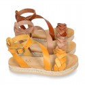 Cowhide leather sandal shoes espadrille style with braided design and buckle closure to the ankle.