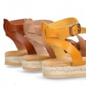 Cowhide leather sandal shoes espadrille style with braided design and buckle closure to the ankle.