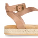 Cowhide leather sandal shoes espadrille style with braided design and buckle closure to the ankle.