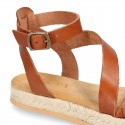 Cowhide leather sandal shoes espadrille style with braided design and buckle closure to the ankle.