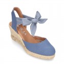 Wedge canvas sandal espadrille with buckle fastening in washing effect.