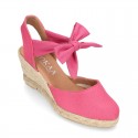 Wedge canvas sandal espadrille with buckle fastening in washing effect.