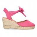 Wedge canvas sandal espadrille with buckle fastening in washing effect.