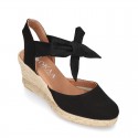 Wedge canvas sandal espadrille with buckle fastening in washing effect.