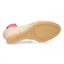 Wedge canvas sandal espadrille with buckle fastening in washing effect.