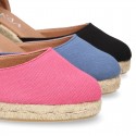 Wedge canvas sandal espadrille with buckle fastening in washing effect.