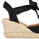 Wedge canvas sandal espadrille with buckle fastening in washing effect.