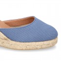 Wedge canvas sandal espadrille with buckle fastening in washing effect.
