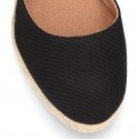 Wedge canvas sandal espadrille with buckle fastening in washing effect.