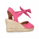 Wedge canvas sandal espadrille with buckle fastening in washing effect.