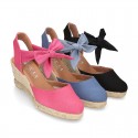 Wedge canvas sandal espadrille with buckle fastening in washing effect.