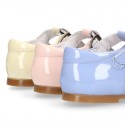 Patent leather little T-Strap shoes with buckle fastening in PASTEL colors.