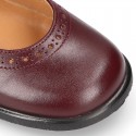 School Classic girl Nappa leather little Mary Jane shoes with perforated design and hook and loop strap.