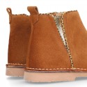 Suede leather kids ankle boot shoes with golden elastic band and zipper closure.