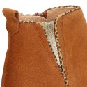 Suede leather kids ankle boot shoes with golden elastic band and zipper closure.