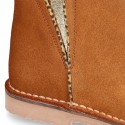 Suede leather kids ankle boot shoes with golden elastic band and zipper closure.